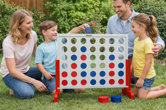 Family playing a giant Connect Four game together in a backyard garden, parents and children enjoying outdoor fun.