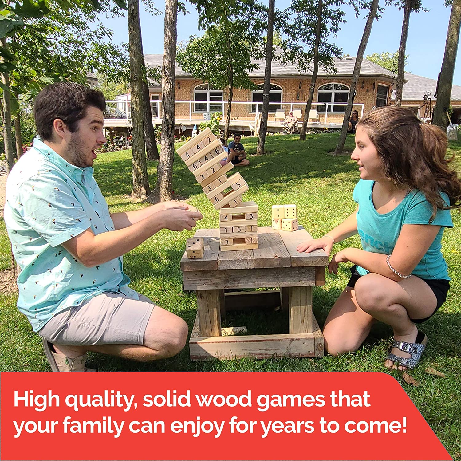 Giant wooden lawn games including dice, dominoes, and tumbling blocks set up outdoors, ideal for backyard, family gatherings, and party games